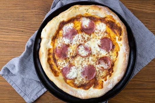 pepperoni pizza with cheese and tomato sauce