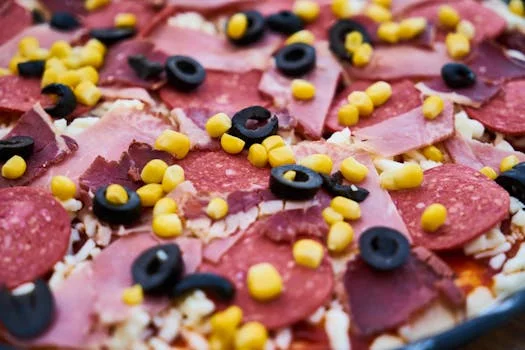 meat lovers pizza with multiple meats and cheese