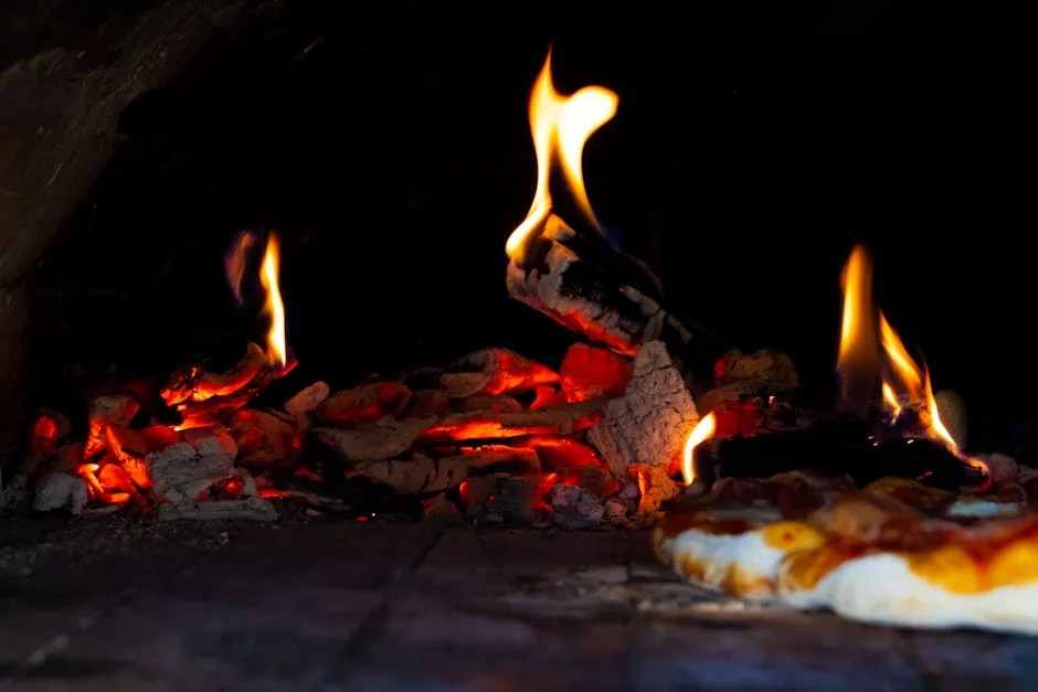 vintage pizza oven with wood fire flames