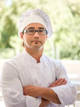 professional chef in white uniform smiling